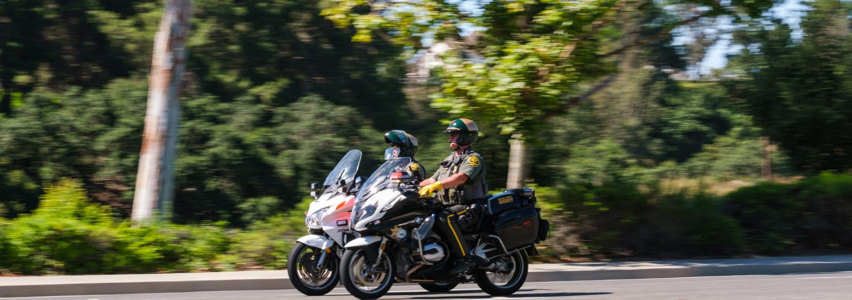 Two police officers driving motorcycles