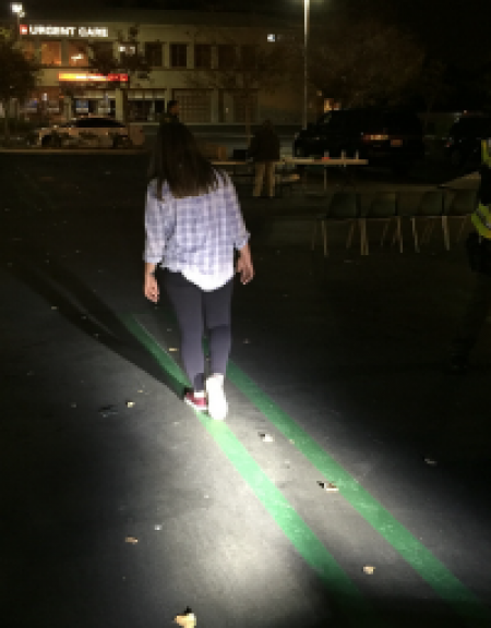 Woman walking straight line during DUI checkpoint