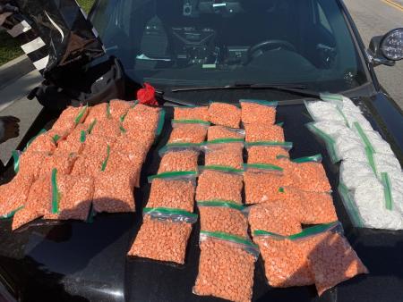 Narcotics investigators seized thousands of illicitly manufactured pills stamped as prescription pills.  